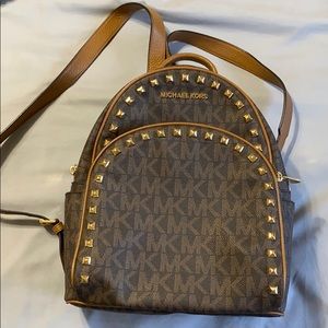 Michael Kors Studded backpack purse.